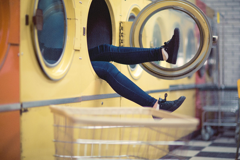drum washing machine in modern laundry room