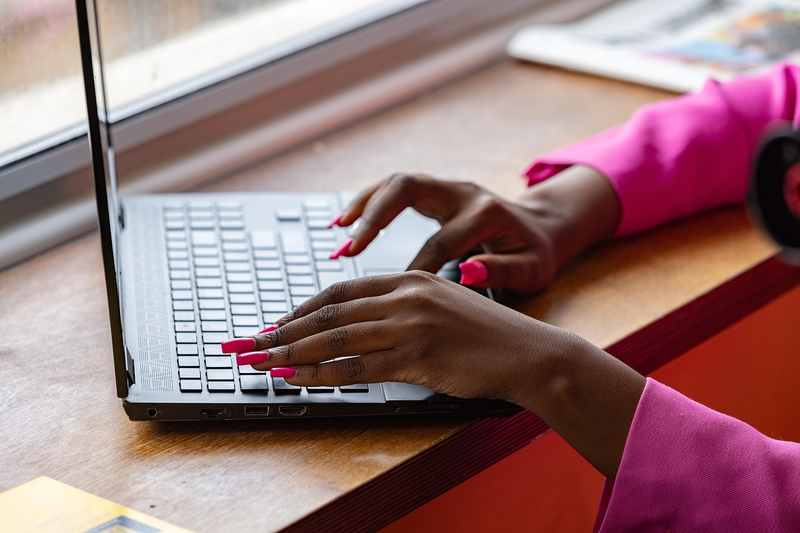 job seeker writing resume at desk