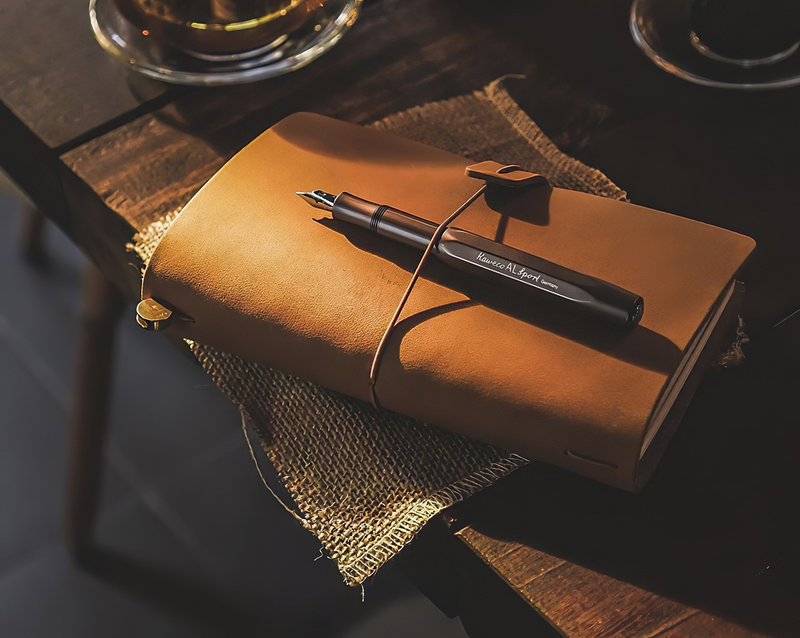 person reading financial investment book at desk making notes